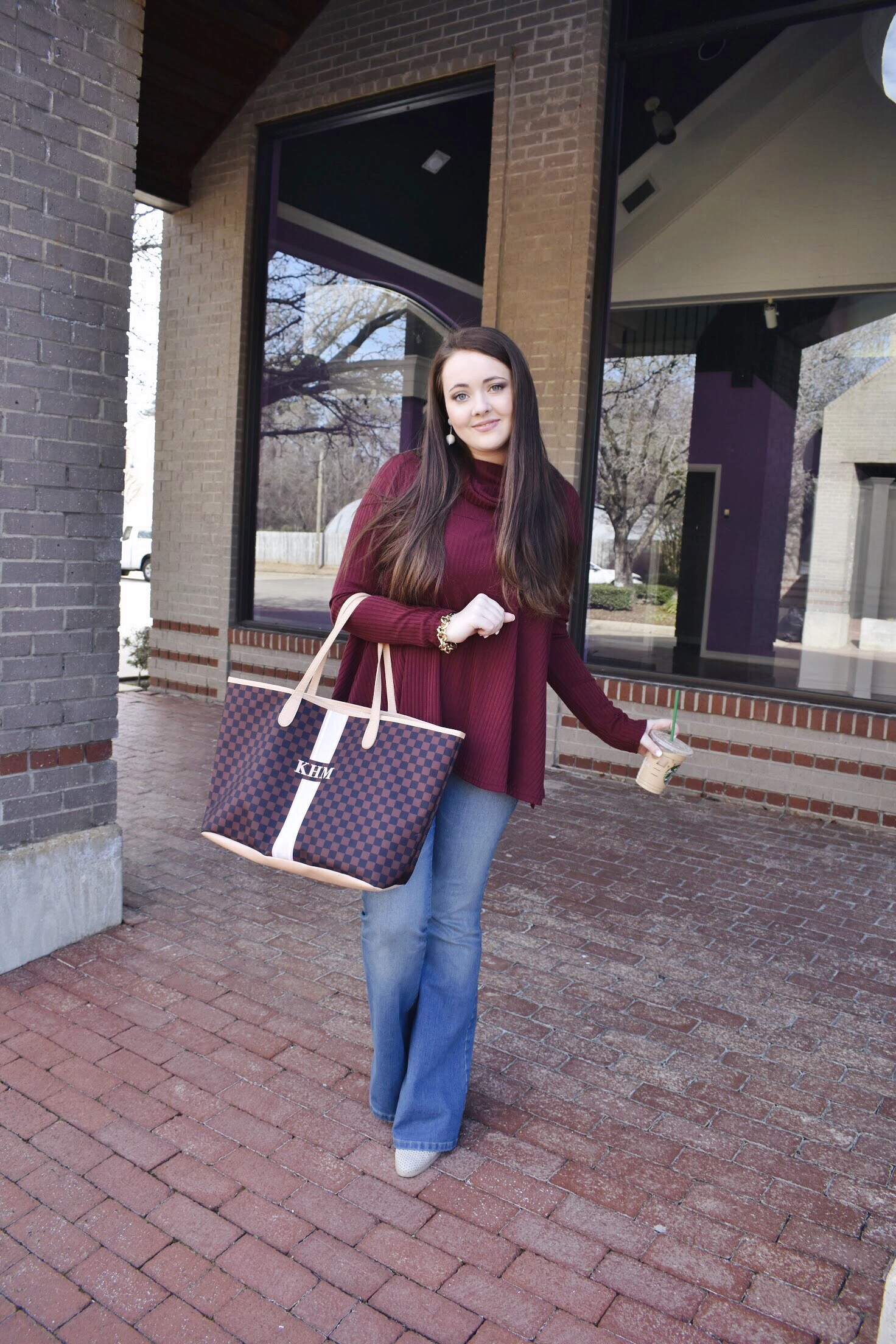 A Flowy Maroon Top With A Touch Of Flare